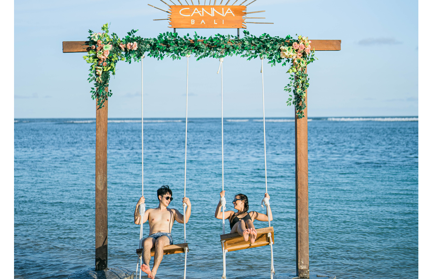 Guest enjoying swing by the beach at Canna Bali